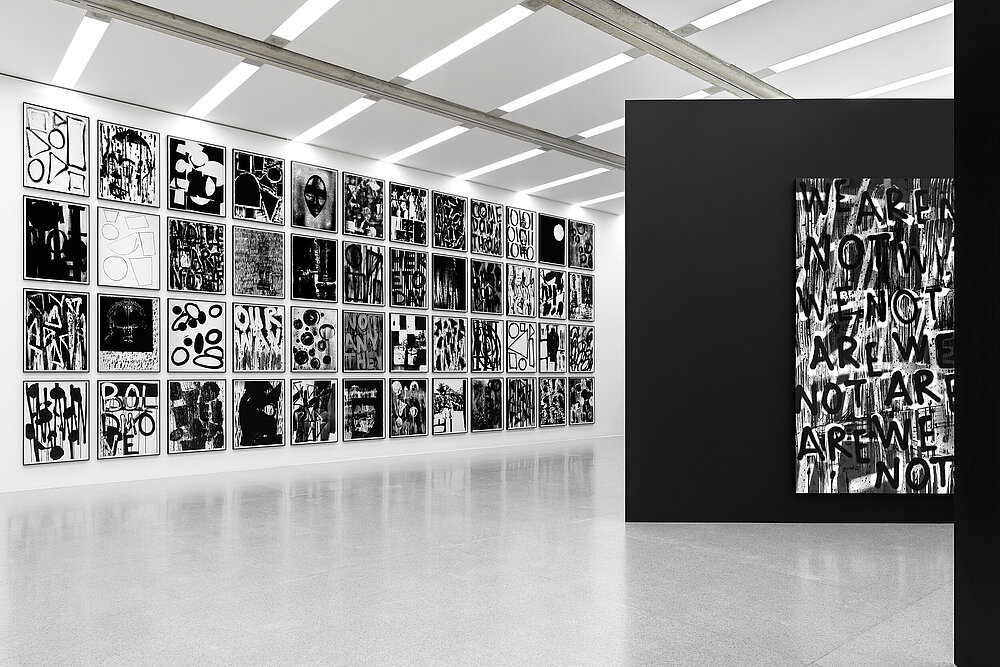 View of an exhibition by Adam Pendleton, with black and white abstract artworks hanging on the walls