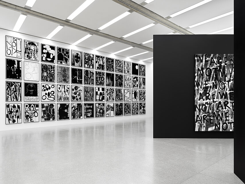 View of an exhibition by Adam Pendleton, with black and white abstract artworks hanging on the walls