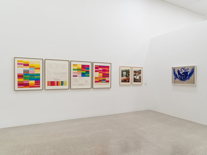 White walls with colourful, abstract pictures in a row
