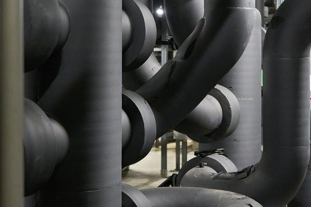 intertwined dark grey pipes