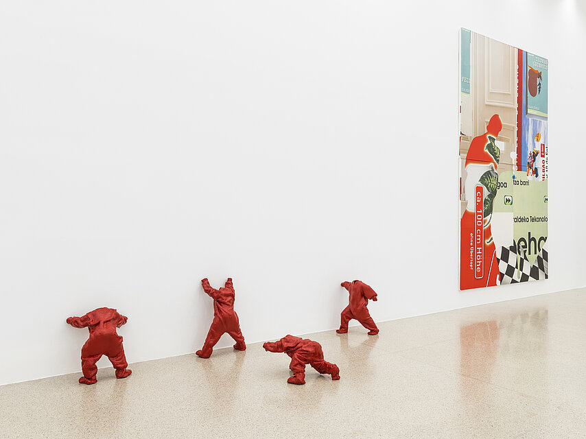 small human-like red sculptures